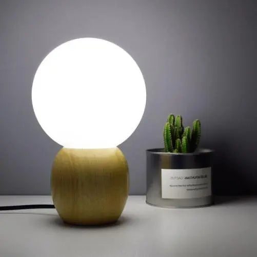 Nordic Solid Wood Milk White Glass Orb 1-Light Table Lamp Cuvalon