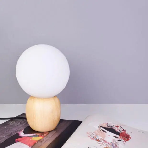 Nordic Solid Wood Milk White Glass Orb 1-Light Table Lamp Cuvalon