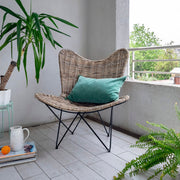 Contemporary Scandinavian Handwoven Rattan Lounge Chair - Accent Chair With Ergonomic Backrest & Iron Base For Boutique Indoor & Outdoor Spaces Cuvalon